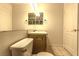 Bathroom featuring toilet, tile floors, vanity, and door at 1721 Mill Canyon Dr, Las Vegas, NV 89128