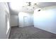 Bedroom with carpet flooring, ceiling fan, neutral paint, and window at 1721 Mill Canyon Dr, Las Vegas, NV 89128