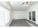Bright bedroom with vaulted ceilings, fan, and large windows allowing ample sunlight at 1721 Mill Canyon Dr, Las Vegas, NV 89128