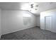 Bedroom with carpet flooring, ceiling fan, neutral paint, and window at 1721 Mill Canyon Dr, Las Vegas, NV 89128