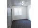Bedroom with plush carpet, closet, and large window with blinds at 1721 Mill Canyon Dr, Las Vegas, NV 89128