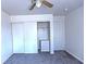Bedroom with carpet, closet with sliding doors, and ceiling fan at 1721 Mill Canyon Dr, Las Vegas, NV 89128