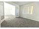 Bedroom featuring carpet flooring, neutral walls, and large glass paneled doors at 1721 Mill Canyon Dr, Las Vegas, NV 89128