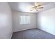 Bedroom with neutral carpet and a ceiling fan, and a window at 1721 Mill Canyon Dr, Las Vegas, NV 89128