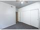 Bright bedroom features neutral paint, ceiling fan, and large sliding door closet at 1721 Mill Canyon Dr, Las Vegas, NV 89128
