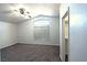 Bedroom with vaulted ceiling, carpet flooring, ceiling fan, and window at 1721 Mill Canyon Dr, Las Vegas, NV 89128