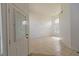 Bright entryway featuring tile floors, a chandelier, and ample natural light from large windows at 1721 Mill Canyon Dr, Las Vegas, NV 89128