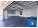 Clean, open garage space with an automatic door opener, great for parking and storage at 1721 Mill Canyon Dr, Las Vegas, NV 89128