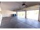 Large, bright garage featuring a spacious layout, automatic door, and ample room for vehicles at 1721 Mill Canyon Dr, Las Vegas, NV 89128