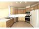Bright kitchen features light wood cabinets, stainless appliances, and white tiled backsplash at 1721 Mill Canyon Dr, Las Vegas, NV 89128