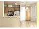 Updated kitchen with light wood cabinets and stainless appliances with breakfast bar area at 1721 Mill Canyon Dr, Las Vegas, NV 89128