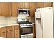 This home's kitchen features stainless steel appliances and oak cabinets at 1721 Mill Canyon Dr, Las Vegas, NV 89128