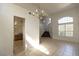 Open-concept living space with tile flooring and a staircase to the upper level at 1721 Mill Canyon Dr, Las Vegas, NV 89128