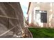 Side yard with minimal landscaping, a brick wall, and partial grass at 1721 Mill Canyon Dr, Las Vegas, NV 89128