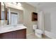 Bathroom featuring a single sink vanity, tiled floors, and a shower-tub combo at 1976 Galleria Spada St, Henderson, NV 89044