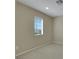 Neutral bedroom featuring carpet floors and a sunlit window view at 1976 Galleria Spada St, Henderson, NV 89044