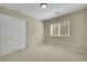Carpeted bedroom with a window and double-door closet at 1976 Galleria Spada St, Henderson, NV 89044