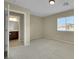 Bedroom with neutral carpet, a window, light walls, and an en-suite bathroom at 1976 Galleria Spada St, Henderson, NV 89044