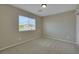 Bedroom featuring a window, neutral carpet, and light, neutral-colored walls at 1976 Galleria Spada St, Henderson, NV 89044