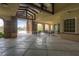 Outdoor seating area with stone columns, a vaulted ceiling, and a view of the pool, perfect for relaxing by the water at 1976 Galleria Spada St, Henderson, NV 89044