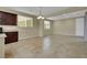Open-concept dining area with tile floors, a modern chandelier, and ample space for entertaining at 1976 Galleria Spada St, Henderson, NV 89044