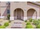 Attractive home entrance with brick pathway and covered archway at 1976 Galleria Spada St, Henderson, NV 89044
