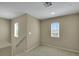 Upstairs hallway landing featuring carpet, windows, and natural lighting at 1976 Galleria Spada St, Henderson, NV 89044
