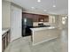 Modern kitchen featuring an island, granite countertops, and stainless steel appliances at 1976 Galleria Spada St, Henderson, NV 89044