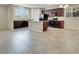 Modern kitchen featuring dark wood cabinets, granite countertops, and black appliances at 1976 Galleria Spada St, Henderson, NV 89044