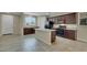 Spacious kitchen with a central island and ample countertop space at 1976 Galleria Spada St, Henderson, NV 89044
