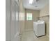 Laundry room featuring tile flooring, shelves, and washer/dryer units at 1976 Galleria Spada St, Henderson, NV 89044