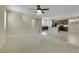 Bright and airy living room with carpet flooring, ceiling fan, and an open floor plan at 1976 Galleria Spada St, Henderson, NV 89044