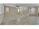 Spacious living room featuring carpet, ample natural light, and staircase access to the second floor at 1976 Galleria Spada St, Henderson, NV 89044