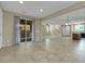 Open-concept living space with tile floors, sliding door access, and a seamless flow to other rooms at 1976 Galleria Spada St, Henderson, NV 89044