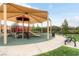 Community playground with sunshade, slides and benches, providing a fun and safe area for  at 1976 Galleria Spada St, Henderson, NV 89044