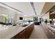 Contemporary kitchen features a center island with bar seating, stylish cabinetry, modern appliances, and an open-concept design at 20 Lakefront Dr, Henderson, NV 89011