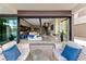 Outdoor living space with comfortable seating and views into the main living area at 20 Lakefront Dr, Henderson, NV 89011