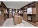 Spacious walk-in closet providing ample storage, shelving and an island for accessories at 20 Lakefront Dr, Henderson, NV 89011