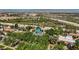 Aerial view of tree-lined property showcasing mature trees and proximity to distant mountains and the city at 204 Canyon Dr, Las Vegas, NV 89107