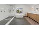 Bright bathroom featuring white subway tile, soaking tub, and custom cabinets at 204 Canyon Dr, Las Vegas, NV 89107