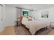Comfortable bedroom with wood floors, bright light, and a cozy rug at 204 Canyon Dr, Las Vegas, NV 89107