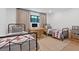 Shared bedroom with two twin beds, a desk and lots of light from the large window at 204 Canyon Dr, Las Vegas, NV 89107