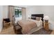Cozy bedroom with wood flooring, a plush rug, and natural light at 204 Canyon Dr, Las Vegas, NV 89107