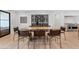 Elegant dining room featuring modern table seating, a wine rack, and hardwood flooring at 204 Canyon Dr, Las Vegas, NV 89107