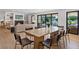 Dining area with hardwood floors, adjacent to the living room with a cozy fireplace at 204 Canyon Dr, Las Vegas, NV 89107
