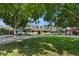 Expansive home showcasing mature trees, lush landscaping, and a circular driveway at 204 Canyon Dr, Las Vegas, NV 89107