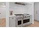 Gourmet kitchen featuring stainless steel appliances, marble countertops, and custom cabinets at 204 Canyon Dr, Las Vegas, NV 89107