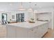 Bright, modern kitchen with a large center island, stylish pendant lighting, and stainless steel appliances at 204 Canyon Dr, Las Vegas, NV 89107