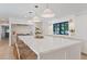 Bright, open kitchen features a large island with seating and modern lighting fixtures at 204 Canyon Dr, Las Vegas, NV 89107