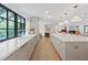 Bright and airy kitchen with a large island, modern fixtures, and a view into the living space at 204 Canyon Dr, Las Vegas, NV 89107